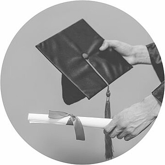 Hands holding a Morterboard and a rolled up paper